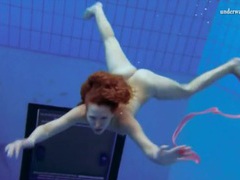 NastyAdult.info presents: Curly hair redhead swims and looks sexy