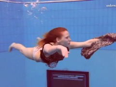 NastyAdult.info presents: Curly red hair girl swims in her panties