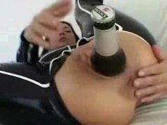NastyAdult.info presents: Chick in latex puts a beer bottle in her ass