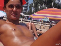 NastyAdult.info presents: Small tits girl with a great tan is topless at the beach