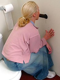 NastyAdult.info presents: Blonde girl Jamie sits on the toilet and blows a black gloryhole dong